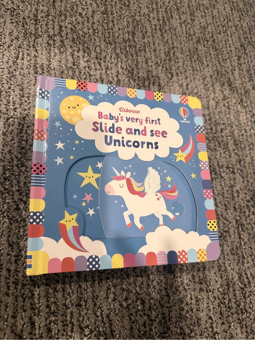 Usborne Baby's Very First Slide and See Unicorns - Blue Unicorn Board Book